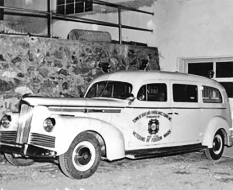 Black and white photograph of an ambulance from the 1950s